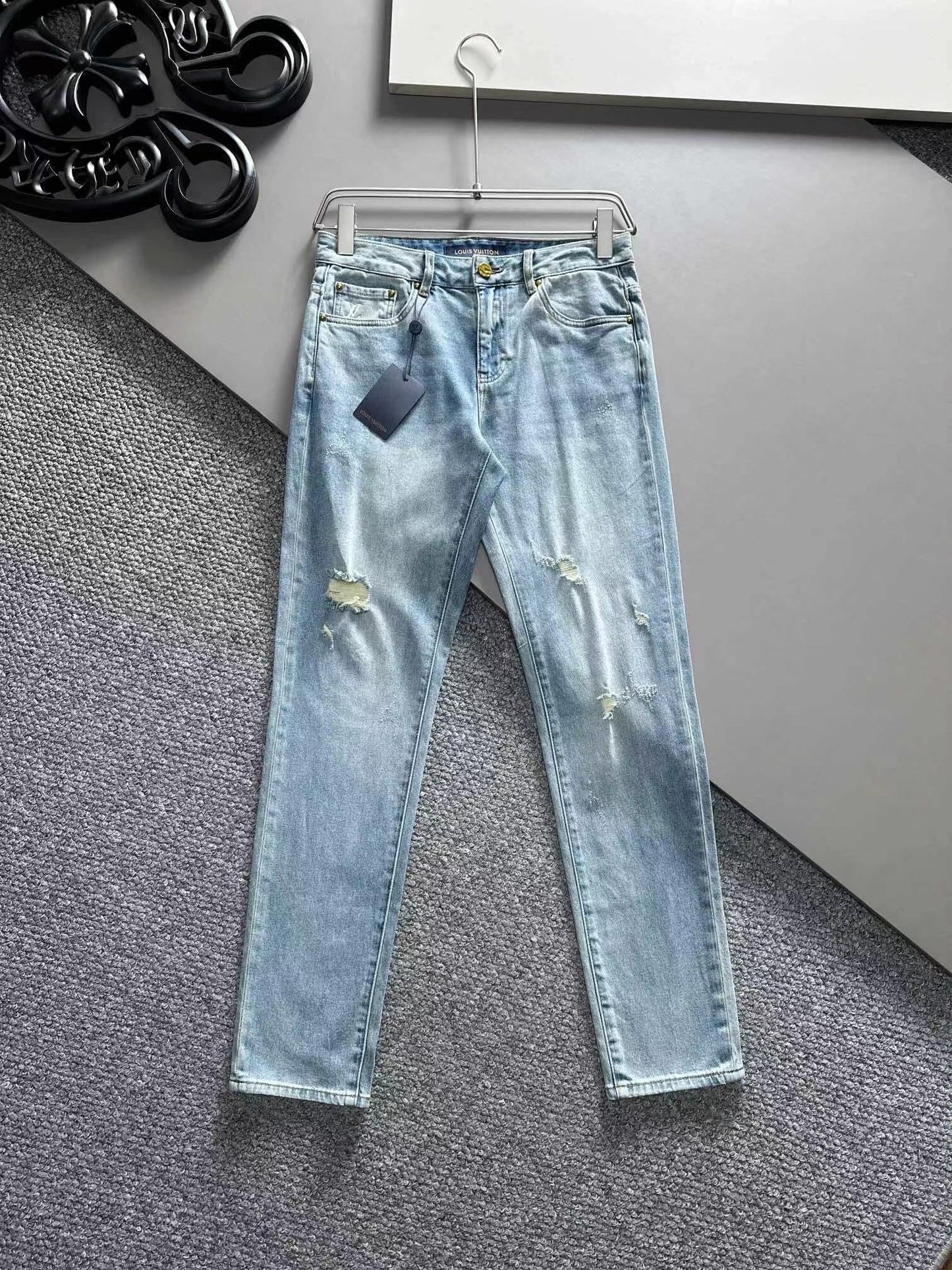 Distressed jeans on the front, lettering on the back