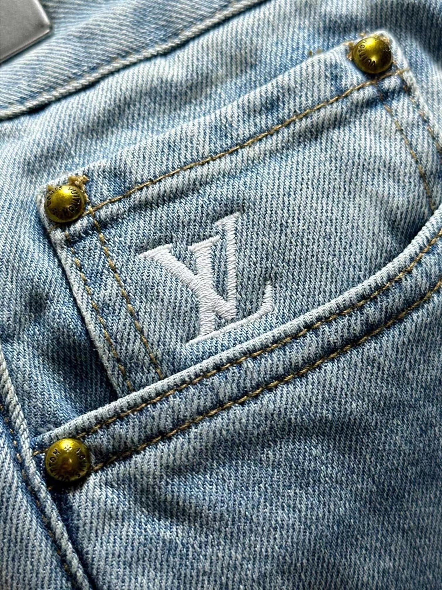 Distressed jeans on the front, lettering on the back